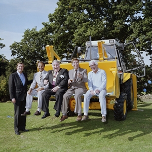 Celebrities in digger bucket.